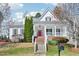 Charming two-story home with a bright red front door, white trim, and landscaped yard at 301 Kinsale Dr, Chapel Hill, NC 27517