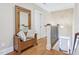 Inviting hallway featuring a wooden bench with pillows and a staircase at 301 Kinsale Dr, Chapel Hill, NC 27517