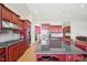 Spacious gourmet kitchen with large island, cherry cabinets, and stainless appliances at 301 Kinsale Dr, Chapel Hill, NC 27517
