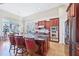 Open concept kitchen with island, stainless appliances and adjacent breakfast nook at 301 Kinsale Dr, Chapel Hill, NC 27517