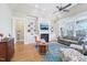 Living room with fireplace, built-in shelving, hardwood floors and abundant natural light at 301 Kinsale Dr, Chapel Hill, NC 27517