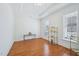 Bright office space with hardwood floors, natural light, and detailed ceiling trim at 301 Kinsale Dr, Chapel Hill, NC 27517