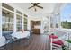 Cozy screened porch with a table and chairs, a bar area, and bright natural lighting at 301 Kinsale Dr, Chapel Hill, NC 27517