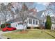 Two-story home with attached garage and a well-maintained lawn, surrounded by mature trees at 301 Kinsale Dr, Chapel Hill, NC 27517