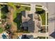 Aerial view of a beautiful home showcasing the roof, landscaping, and surrounding neighborhood at 321 Weycroft Grant Dr, Cary, NC 27519
