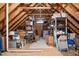 Spacious attic storage with exposed beams and shelving for organized storage at 321 Weycroft Grant Dr, Cary, NC 27519
