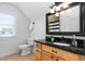Bathroom with granite countertop vanity and decorative mirror at 321 Weycroft Grant Dr, Cary, NC 27519