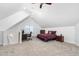 Bright bedroom with a vaulted ceiling, cozy carpet, desk, and ample storage at 321 Weycroft Grant Dr, Cary, NC 27519