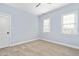 Empty bedroom with neutral walls, carpet, and bright natural light at 321 Weycroft Grant Dr, Cary, NC 27519