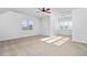 Large, bright bedroom with a ceiling fan and natural light from the windows at 321 Weycroft Grant Dr, Cary, NC 27519