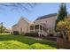 Beautiful brick home with a screened porch overlooking the lush green backyard at 321 Weycroft Grant Dr, Cary, NC 27519