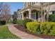 Charming front porch with columns and beautiful landscaping creating inviting curb appeal at 321 Weycroft Grant Dr, Cary, NC 27519