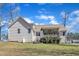 View of the backyard showing the spacious, grassy area and the rear exterior of the home at 34 Triton Ct, Clayton, NC 27520