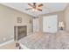 Bedroom with neutral walls, a large window, closet, and a ceiling fan for added comfort at 34 Triton Ct, Clayton, NC 27520