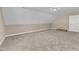 Bright bonus room with carpet, featuring neutral paint and an attic access door at 34 Triton Ct, Clayton, NC 27520
