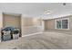 Large carpeted bonus room with neutral walls and trim with a bright window at 34 Triton Ct, Clayton, NC 27520