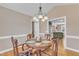 Cozy dining room featuring a round table with seating for four and an open view to the kitchen at 34 Triton Ct, Clayton, NC 27520
