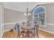 Well-lit dining area with a classic wooden table, offering a view of the outdoors at 34 Triton Ct, Clayton, NC 27520
