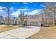 Single-Gathering home on a large lot features a long concrete driveway to the attached two car garage at 34 Triton Ct, Clayton, NC 27520