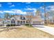 Charming single-Gathering home with a manicured lawn, attached garage, and welcoming front porch at 34 Triton Ct, Clayton, NC 27520