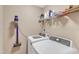 Laundry room equipped with a washer, dryer, shelves, and storage solutions at 34 Triton Ct, Clayton, NC 27520