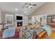 Open-plan living area with a fireplace, hardwood floors, and views of the kitchen with neutral color palette at 34 Triton Ct, Clayton, NC 27520