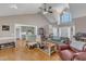 Inviting open-concept living area with a neutral color palette, hardwood flooring, and a view to the kitchen at 34 Triton Ct, Clayton, NC 27520