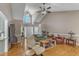 Bright living room with vaulted ceiling and lots of natural light flows to the entry hall and kitchen at 34 Triton Ct, Clayton, NC 27520