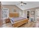 Comfortable main bedroom with a large bed, vaulted ceilings, and windows that let in plenty of natural light at 34 Triton Ct, Clayton, NC 27520