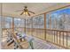 Relaxing screened porch with ceiling fan and outdoor furniture, perfect for enjoying the outdoors at 34 Triton Ct, Clayton, NC 27520