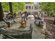 Backyard featuring a fire pit and custom wooden seating, perfect for outdoor gatherings at 405 Silver Creek Trl, Chapel Hill, NC 27514