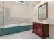 Bathroom featuring a vanity, free-standing tub, and a tiled shower with glass surround at 405 Silver Creek Trl, Chapel Hill, NC 27514