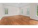 Bedroom featuring hardwood floors, a vaulted ceiling, windows, and neutral paint at 405 Silver Creek Trl, Chapel Hill, NC 27514