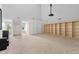 Bright bonus room with natural light, projector, and built-in shelving for versatile use at 405 Silver Creek Trl, Chapel Hill, NC 27514