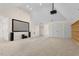 Large bonus room featuring a projector, screen, and built-in shelving, great for entertainment at 405 Silver Creek Trl, Chapel Hill, NC 27514
