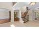 Grand foyer featuring elegant staircase and hardwood flooring throughout at 405 Silver Creek Trl, Chapel Hill, NC 27514