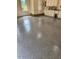 Garage featuring epoxy flooring, windows for natural light, and storage cabinets at 405 Silver Creek Trl, Chapel Hill, NC 27514