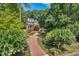Beautiful brick home with a circular driveway and lush landscaping at 405 Silver Creek Trl, Chapel Hill, NC 27514