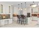 Beautiful eat-in kitchen features an island with seating, white cabinetry, and stainless appliances at 405 Silver Creek Trl, Chapel Hill, NC 27514