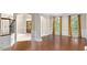 Spacious living room with hardwood floors, natural light, and elegant trim at 405 Silver Creek Trl, Chapel Hill, NC 27514