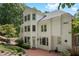 Stunning multi-story home with a brick patio and a lush, green landscape at 405 Silver Creek Trl, Chapel Hill, NC 27514