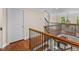 Elegant staircase featuring wood and iron finishes that overlooks the foyer at 405 Silver Creek Trl, Chapel Hill, NC 27514