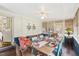 Sunlit dining room with a large table, perfect for hosting gatherings, and views of the outdoors at 411 Circle Dr, Burlington, NC 27215