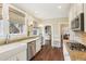 Charming kitchen with stainless appliances, granite countertops, and natural window shades at 411 Circle Dr, Burlington, NC 27215
