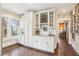 Butler's pantry with white cabinetry, granite countertops, and wine rack at 411 Circle Dr, Burlington, NC 27215