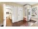 Bright kitchen features stainless steel refrigerator, a small red stool, and access to the rest of the house at 411 Circle Dr, Burlington, NC 27215