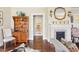 Elegant living room with a fireplace, hardwood floors, and traditional furnishings, creating a welcoming atmosphere at 411 Circle Dr, Burlington, NC 27215