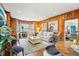 Bright living room with a fireplace, hardwood floors, and comfortable seating, perfect for relaxation and entertaining at 411 Circle Dr, Burlington, NC 27215