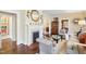 Bright living room with a fireplace, hardwood floors, and traditional furnishings, creating a welcoming atmosphere at 411 Circle Dr, Burlington, NC 27215