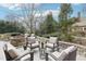 Spacious patio area featuring comfortable seating around a stone fire pit, great for gatherings at 411 Circle Dr, Burlington, NC 27215